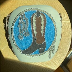 Western cowboy boot ceramic vase with leather and silver button details
